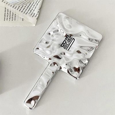 Alledaagse aangepaste handgreep handspiegel logo aangepaste kleine glitter zilveren make-up spiegels